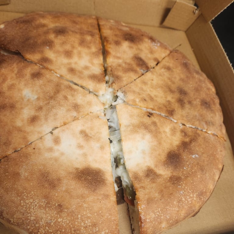 Indulge in Our Meat Pizza